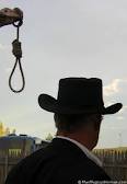 Hangman's noose with cowboy looking on