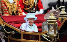 The Queen waving from carriage