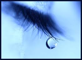 Teardrop falling from eyelashes